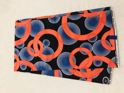 African Wax 6 yards orange blue and black rings and bubles design real African print. Ankanra 100% cotton material.